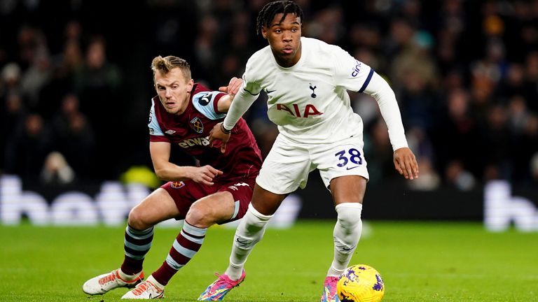 Tottenham Hotspur&#39;s Destiny Udogie battles for the ball with West Ham United&#39;s James Ward-Prowse