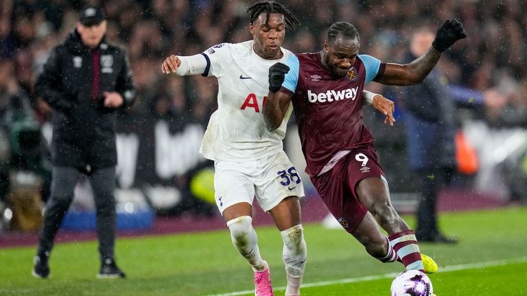 West Ham's Michail Antonio competes for the ball with Tottenham's Destiny Udogie